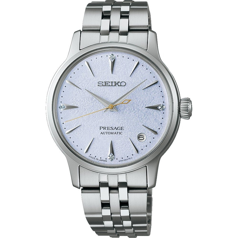 Zilveren dames horloge met een lichtblauwe wijzerplaat, automatische beweging en een metalen schakelband.