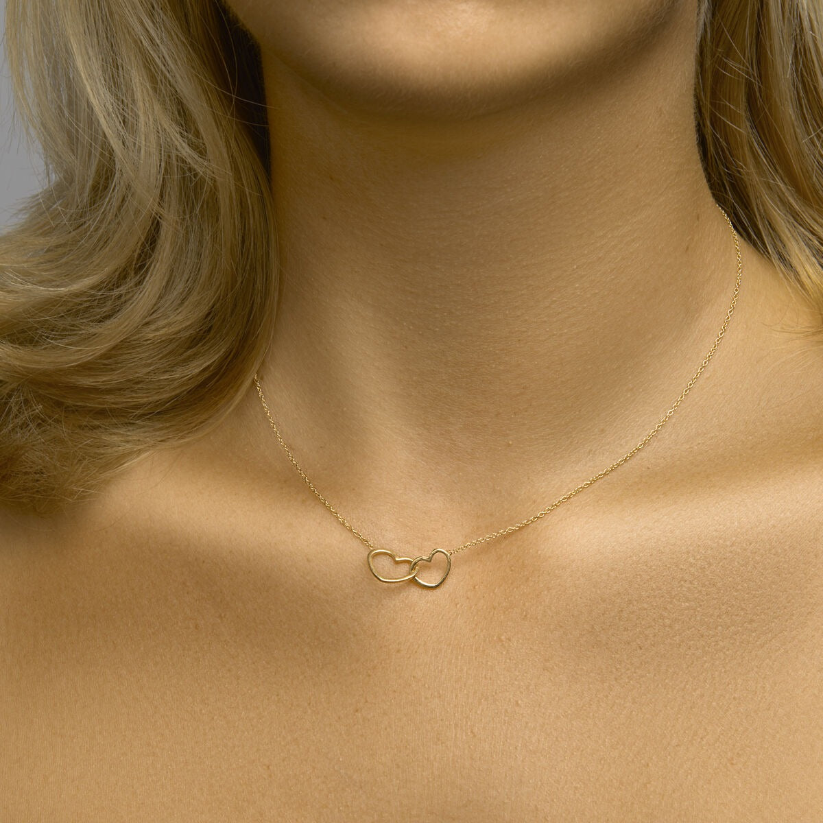 Collar chapado en oro de plata con dos corazones