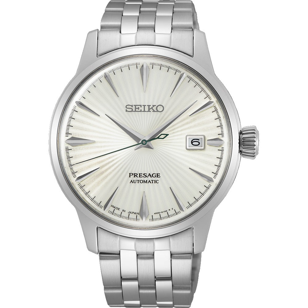 Reloj de hombre Seiko automático con esfera plateada, caja y pulsera de acero inoxidable.