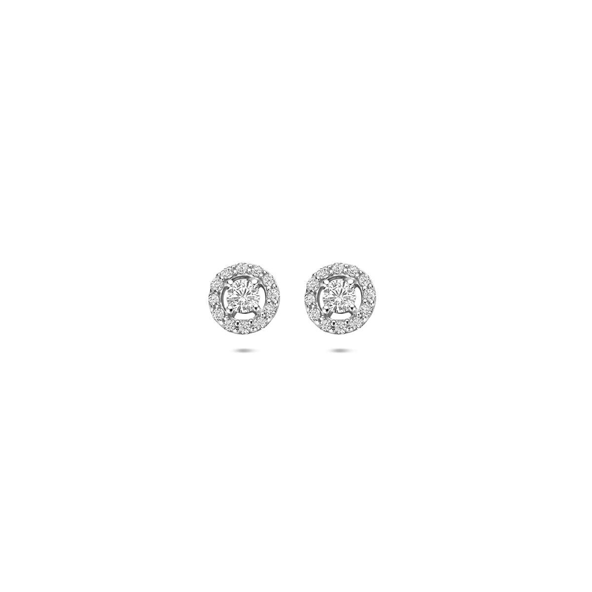Pendientes de primera puesta plateados con circonitas, acabado rodiado y forma redonda.