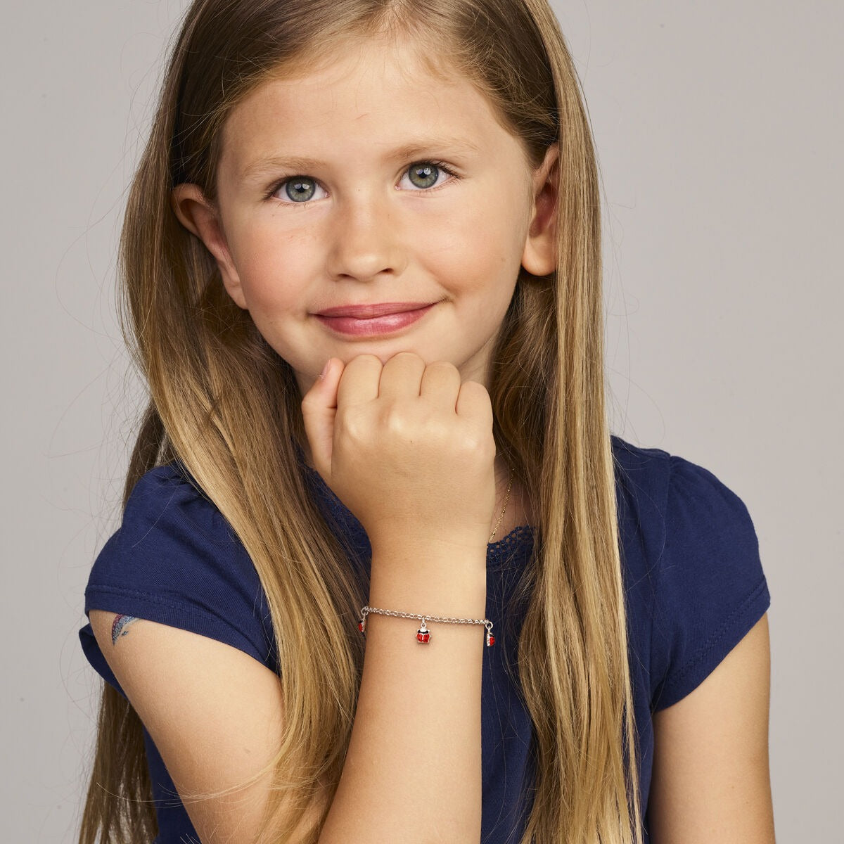 Pulsera infantil de plata con mariquitas – rodiada