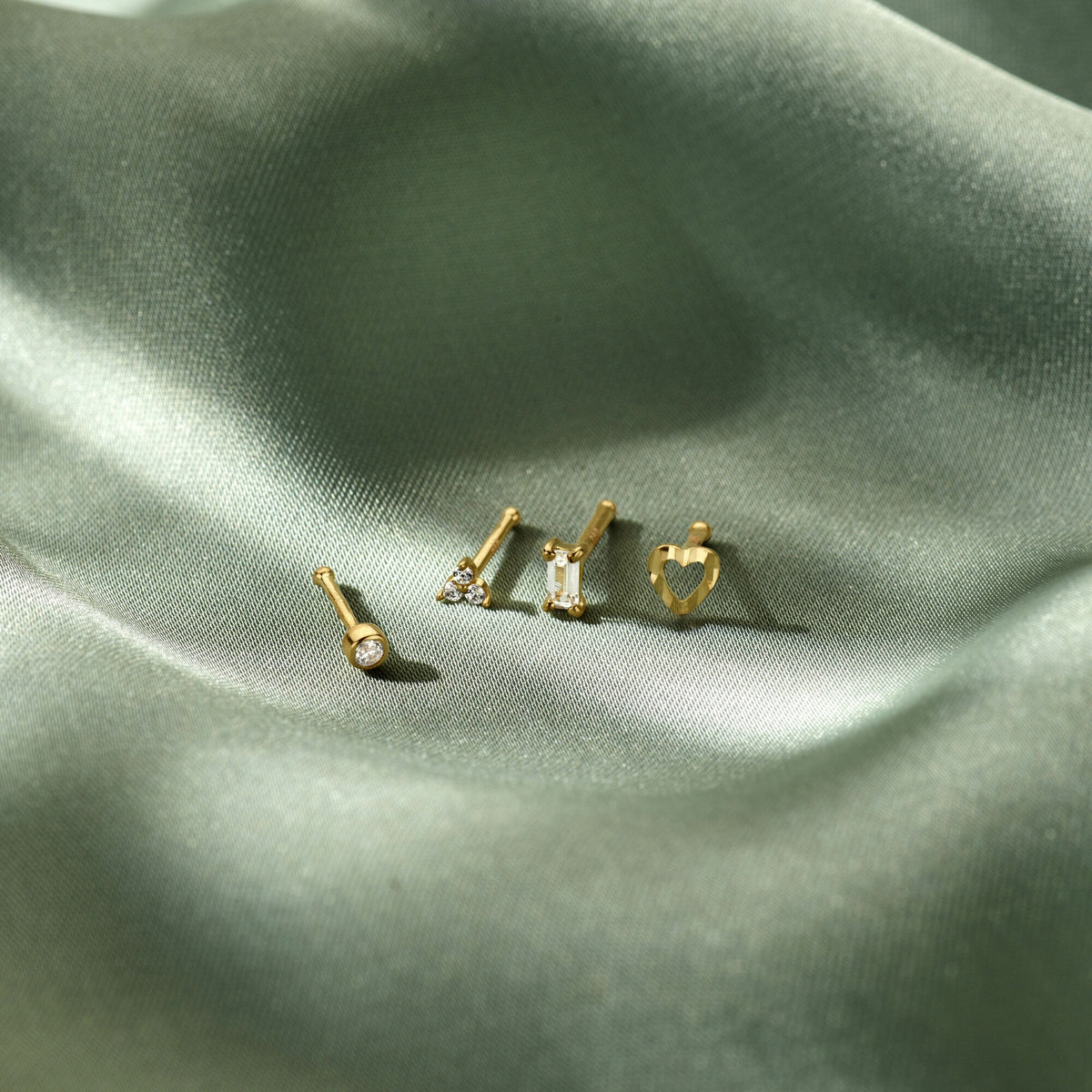 pestaña de oro amarillo de 14k con circonita tallada en brillante