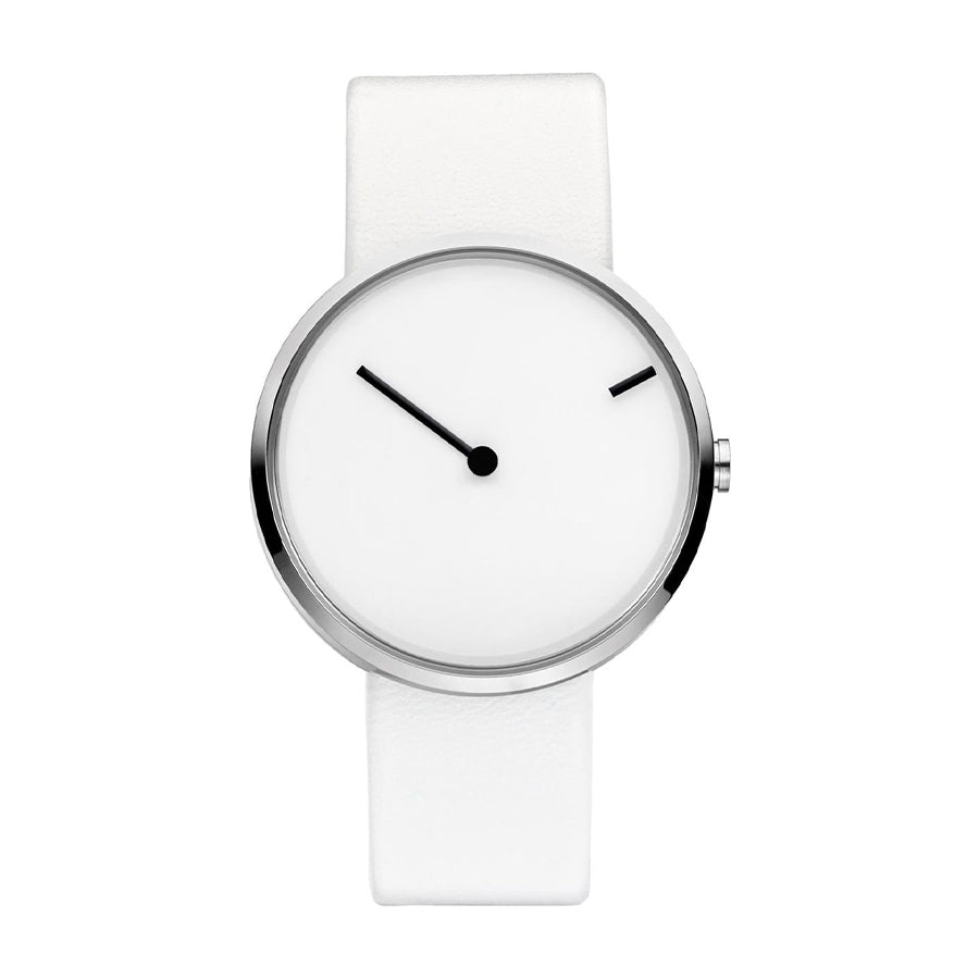Reloj minimalista con esfera blanca y correa de silicona blanca, manecillas negras.