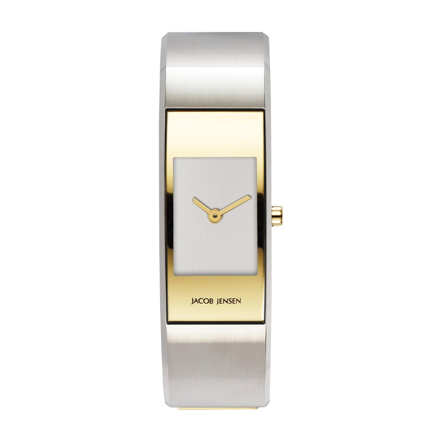 Reloj rectangular de acero inoxidable con acabado plateado y dorado, esfera blanca y manecillas doradas.