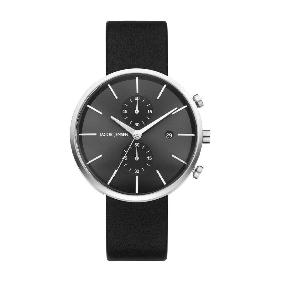 Reloj de esfera negra con correa de silicona negra y detalles plateados.