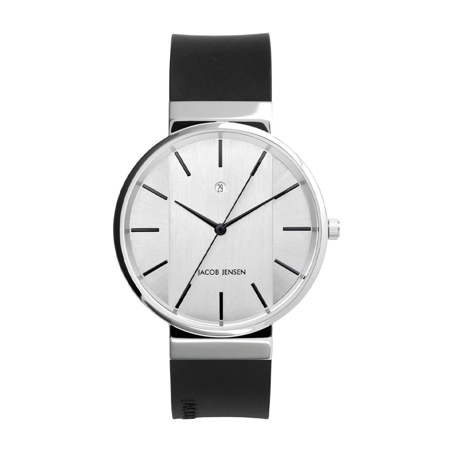 Reloj de esfera plateada con correa de silicona negra y detalles minimalistas.