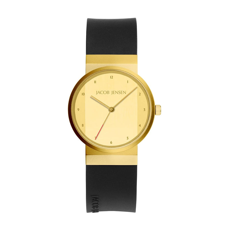 Reloj de esfera dorada con correa de silicona negra y detalles minimalistas.
