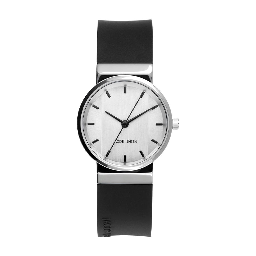 Reloj de esfera plateada con correa de silicona negra y detalles minimalistas.