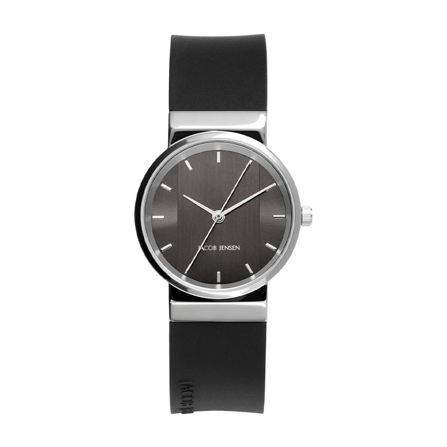 Reloj con esfera gris y correa de silicona negra, diseño minimalista y moderno.