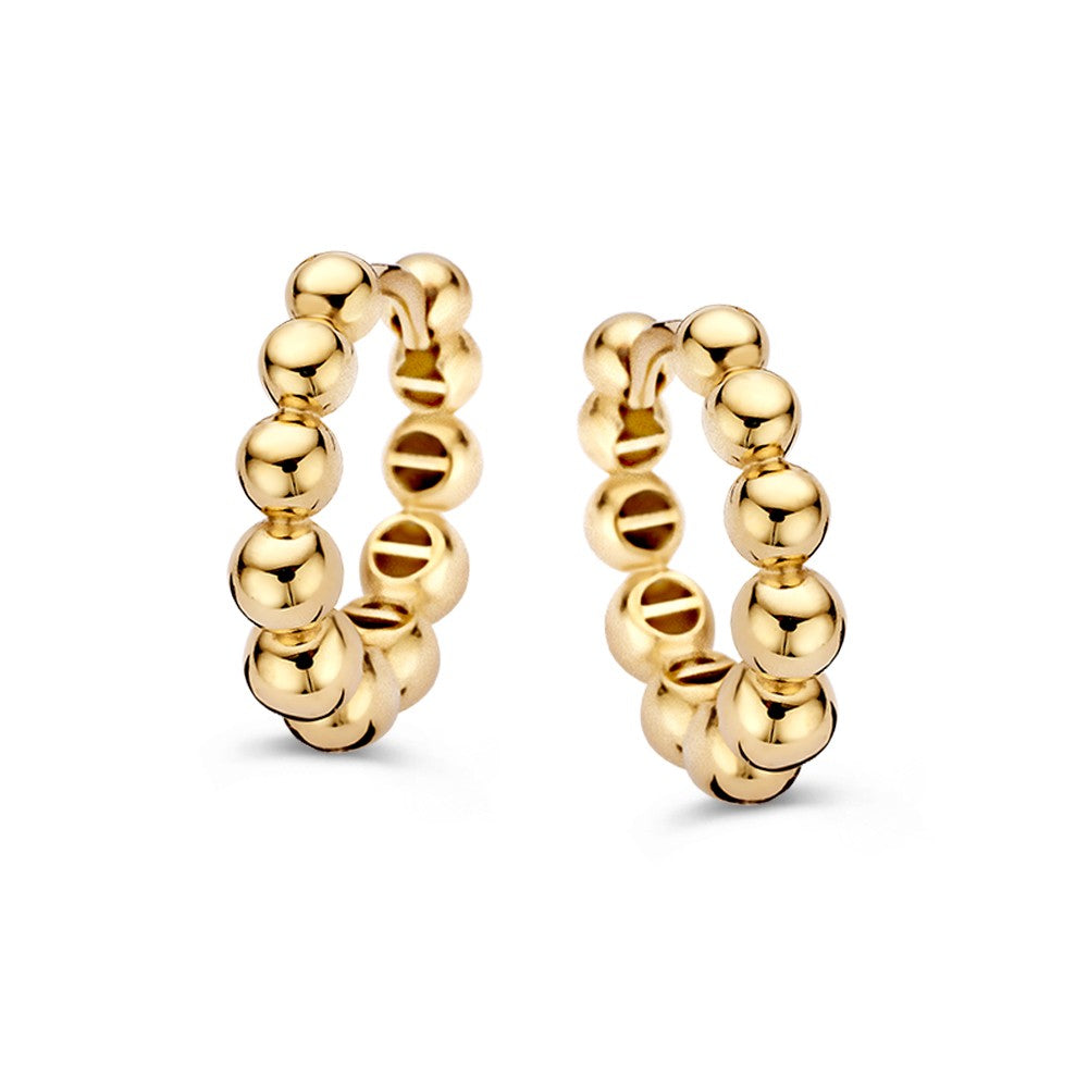 Aros de oro amarillo con bolitas doradas, diseño juguetón y elegante.