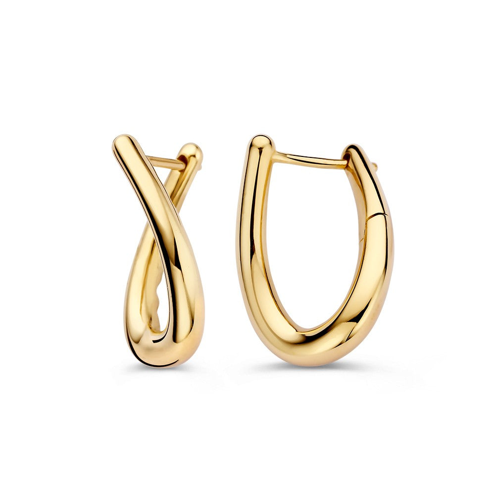 Aros de oro amarillo juguetones con giro – Elegancia en movimiento
