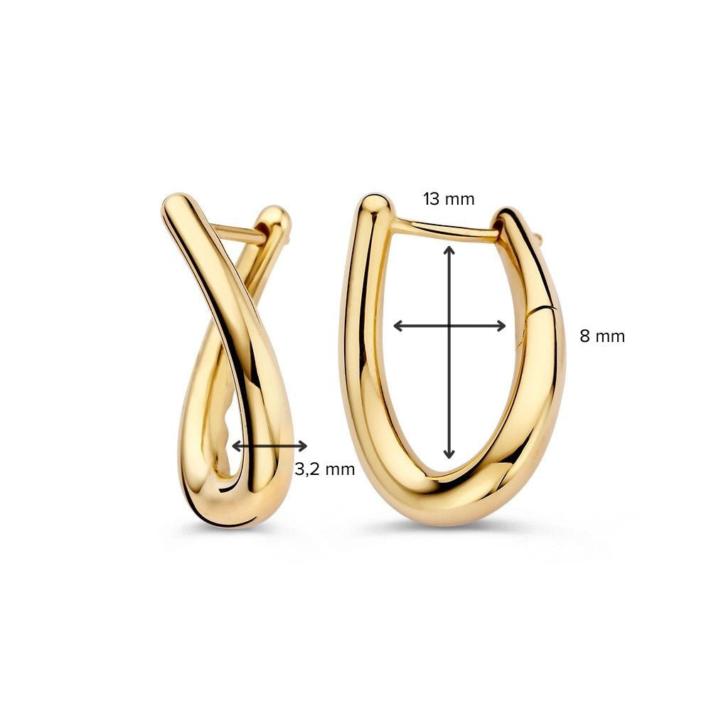Aros de oro amarillo juguetones con giro – Elegancia en movimiento