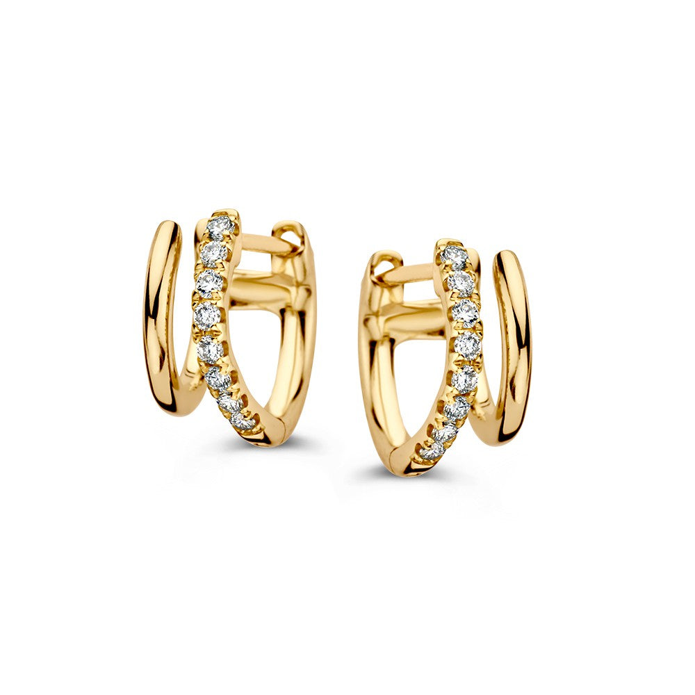 Aros de oro amarillo con diamantes, diseño juguetón y doble función.