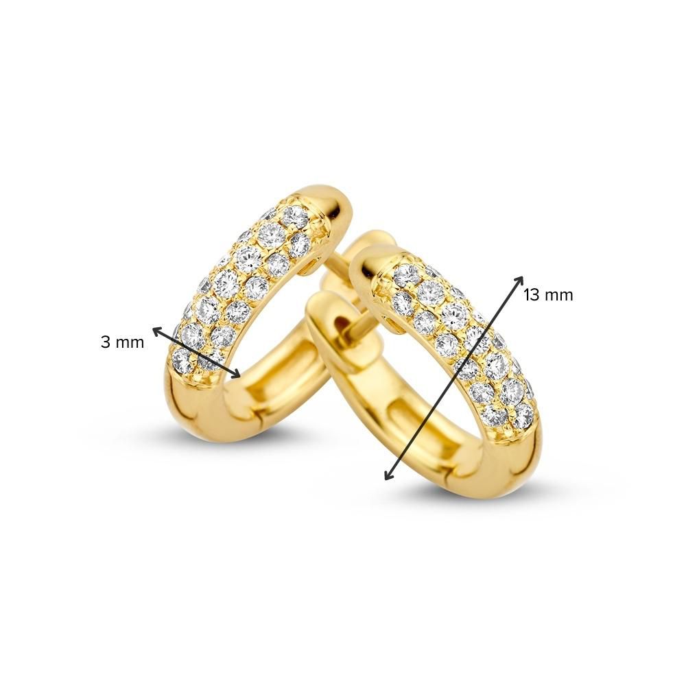 Aros de oro amarillo con diamante: elegancia atemporal y brillo 0,32 crt.