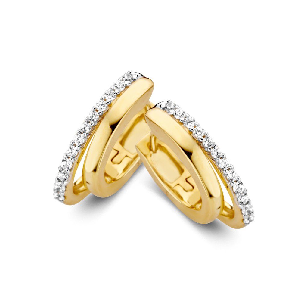 Aros de oro con bandas asimétricas y circonitas.