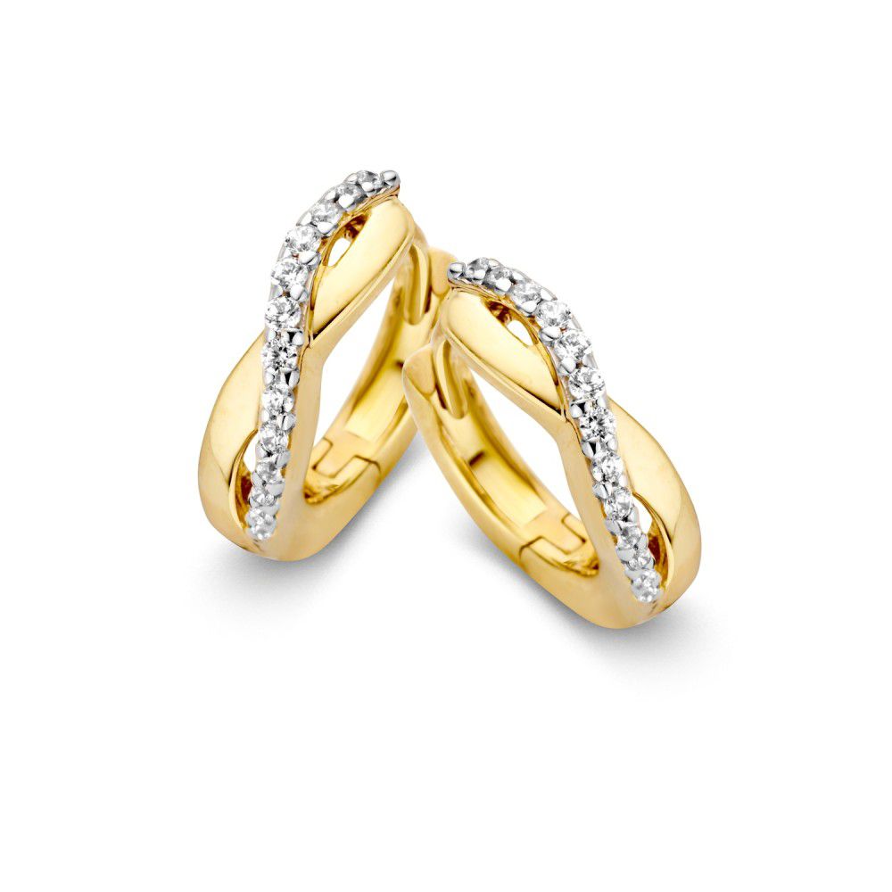 Aros de oro con una línea juguetona de circonitas brillantes.