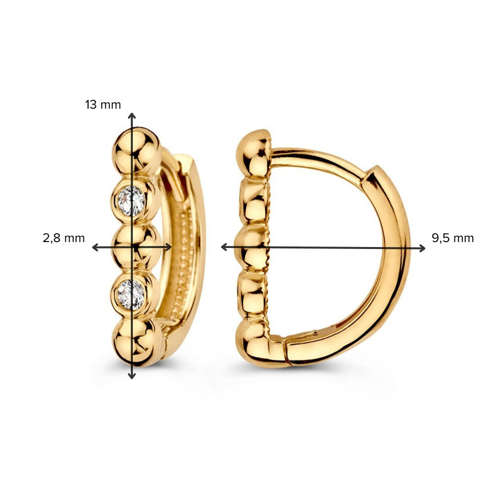 Aros de oro amarillo modernos con circonitas en diseño elegante