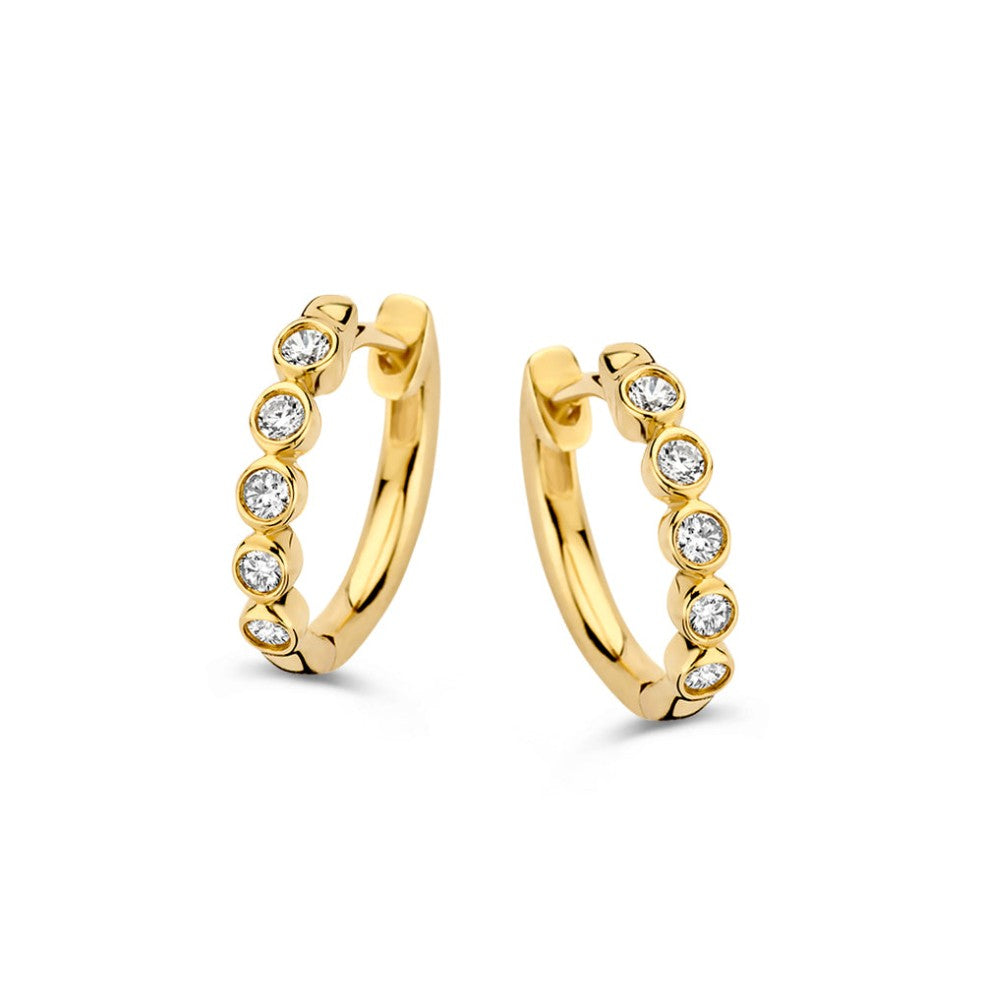 Aros de oro amarillo con diamantes de 0,20 ct, diseño circular y brillante.