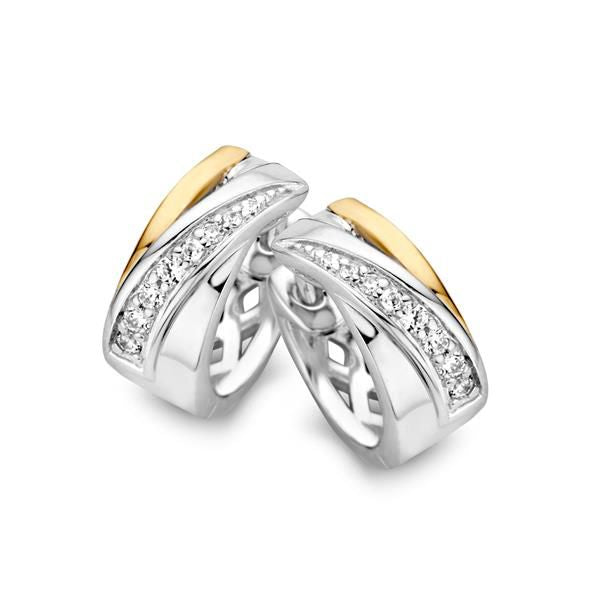 Pendientes de aro elegantes en plata y oro con circonitas brillantes.