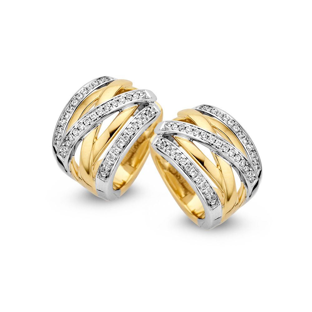 Aros bicolores de oro amarillo y blanco con diamantes, 14 quilates, 0.36 quilates de brillantes.