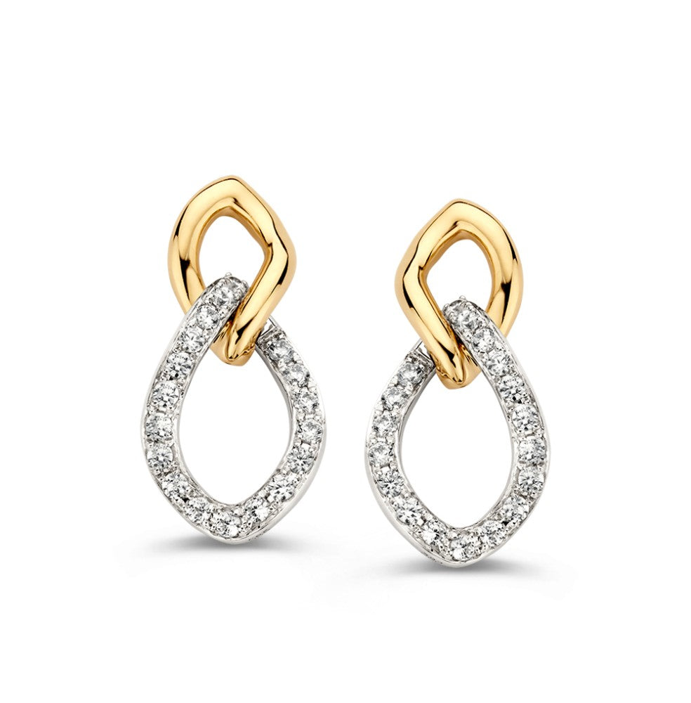 Pendientes bicolor de oro blanco y amarillo con circonitas en forma de gota.