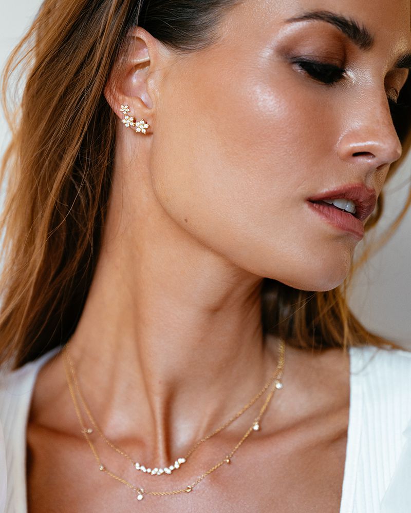 Aros de oro amarillo con tres estrellas y diamantes – 1,05 crt.