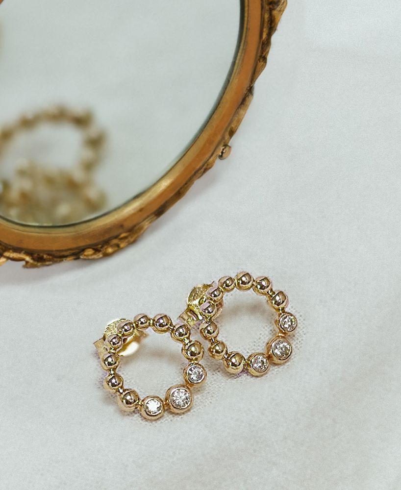Pendientes de oro amarillo con circonitas - Diseño juguetón | 14 quilates de oro - Van der Kooij