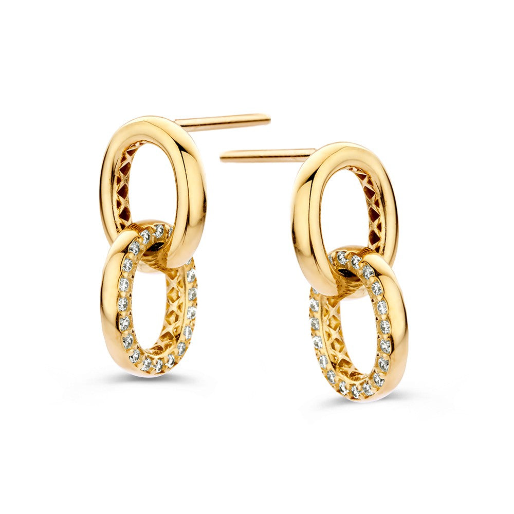Pendientes de oro amarillo con charms redondos y circonitas, diseño juguetón y lujoso.
