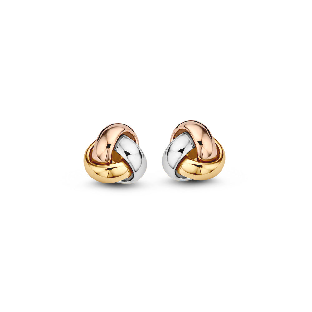 Pendientes de botón tricolores en modelo de nudo, elaborados en oro de 14 quilates.