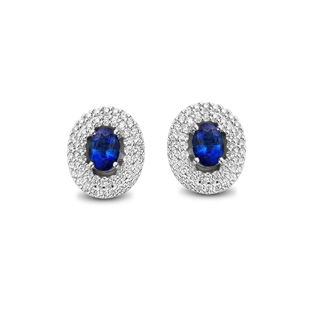Pendientes de oro blanco con zafiro azul y diamantes, con forma ovalada y detalle brillante.