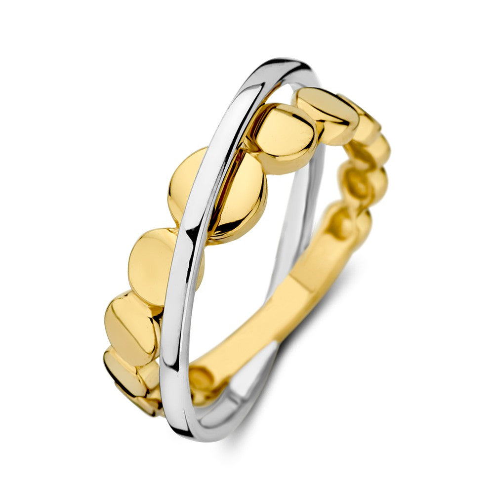 Anillo bicolor de oro blanco y amarillo con dos bandas cruzadas, acabado brillante.