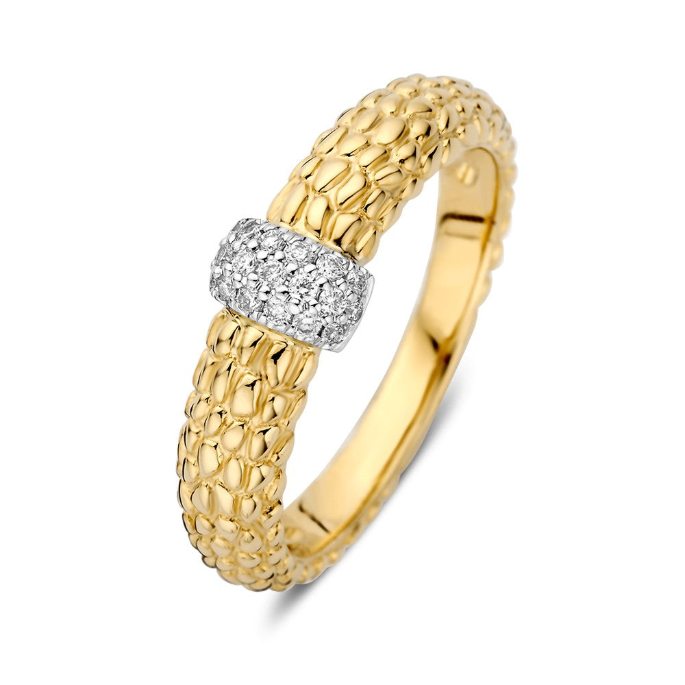 Anillo bicolor con brillante de 0.14 crt, con textura dorada y detalle central de diamantes.