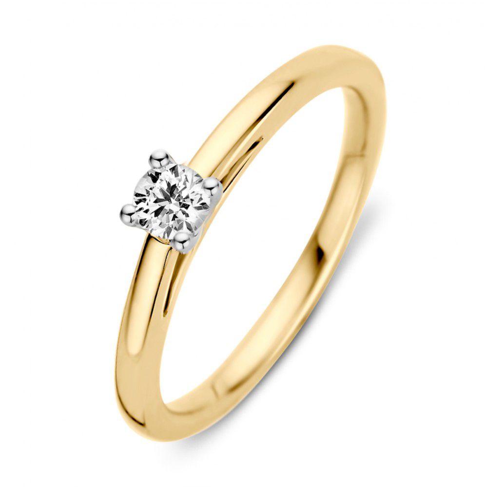 Anillo bicolor de oro blanco y amarillo con un brillante de 0.19 crt.