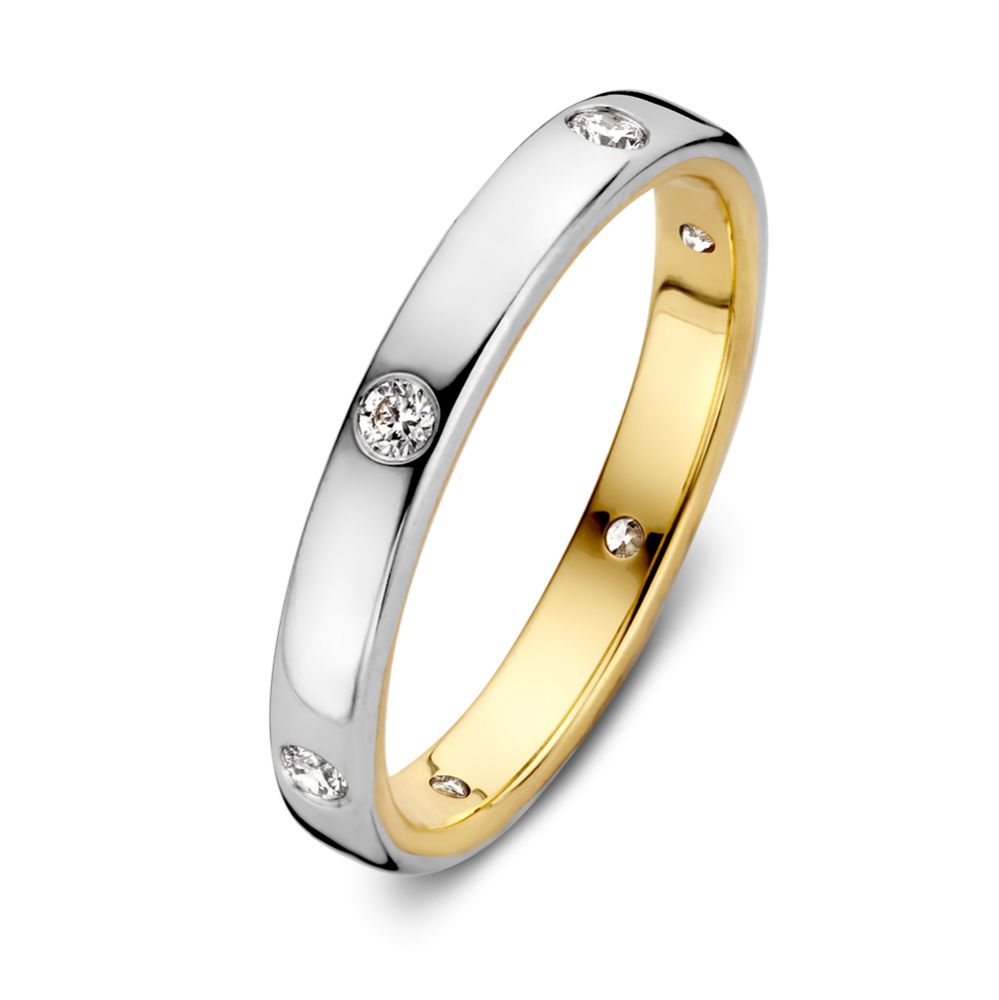 Anillo bicolor de oro con diamantes de 0.20 quilates, acabado brillante y forma circular.