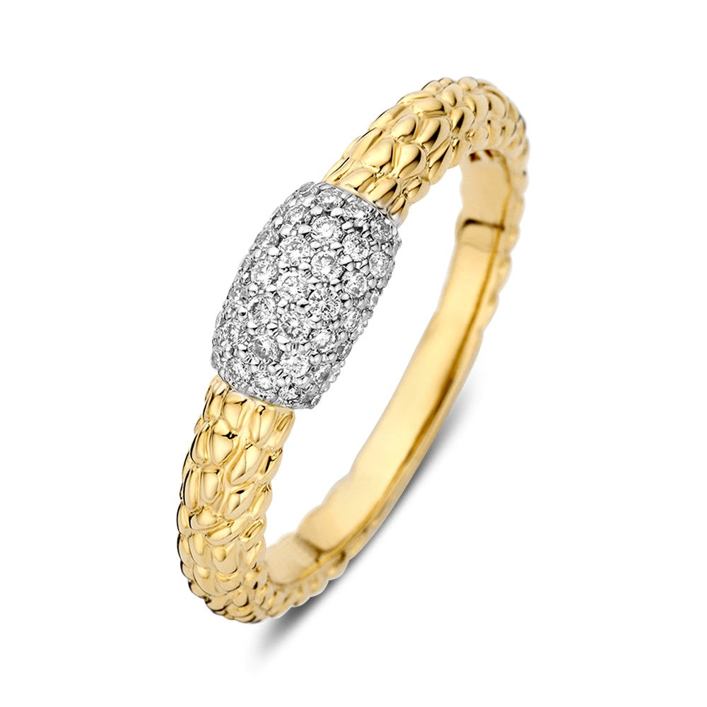 Anillo bicolor con brillante de 0.22 crt, con detalle de diamantes en la parte central y acabado dorado.