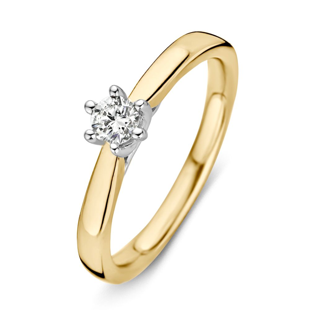 Anillo bicolor de oro amarillo y blanco con diamante de 0,24 ct.