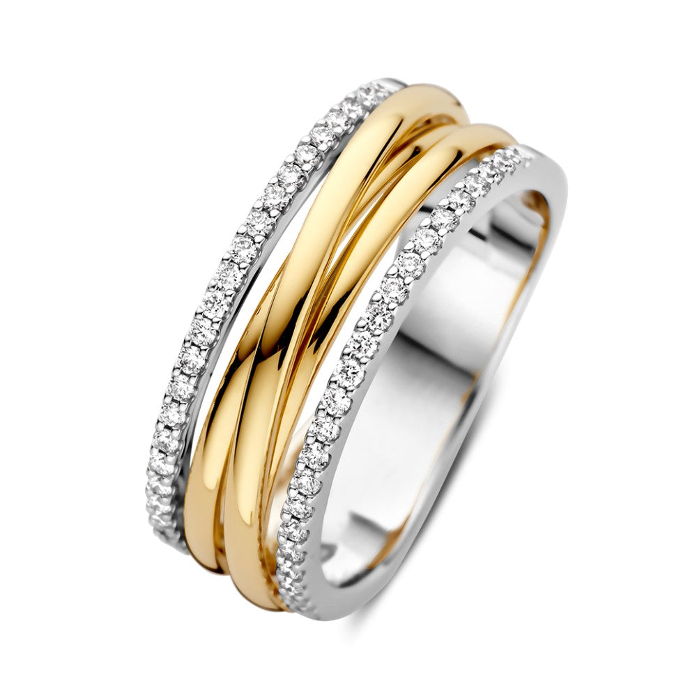 Anillo bicolor de oro amarillo y blanco con diamantes de 0,27 ct, diseño refinado.
