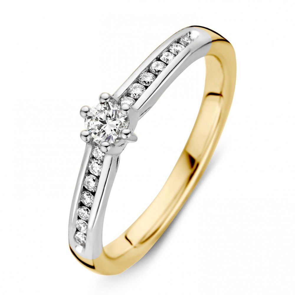 Anillo bicolor de 14 quilates en oro amarillo y blanco con un brillante de 0,30 ct.