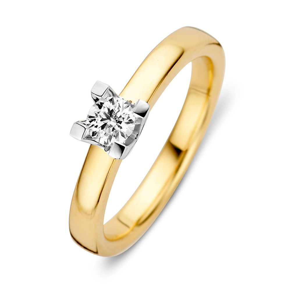 Anillo de oro amarillo y blanco con un diamante brillante de 0,30 crt en engaste de cuatro garras.