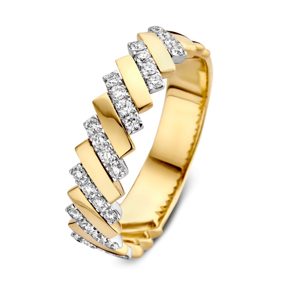 Anillo bicolor de oro amarillo y blanco con diamantes de 0,30 crt, diseño ondulado.
