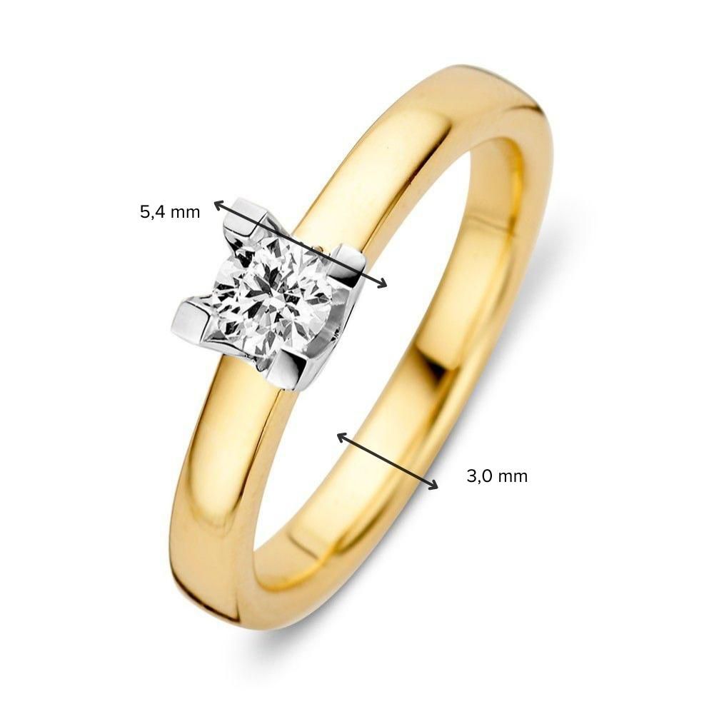 Anillo solitario de oro amarillo y oro blanco con diamante brillante de 0,30 crt y engaste de cuatro garras 0,30 crt.