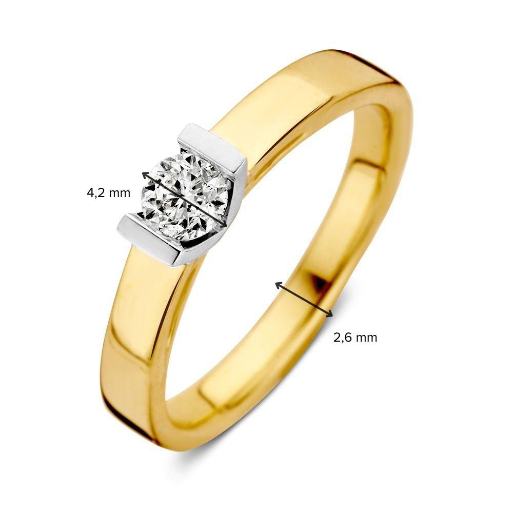 Anillo solitario bicolor de oro blanco y oro amarillo con piedra central de diamante tallada de 0,30 crt