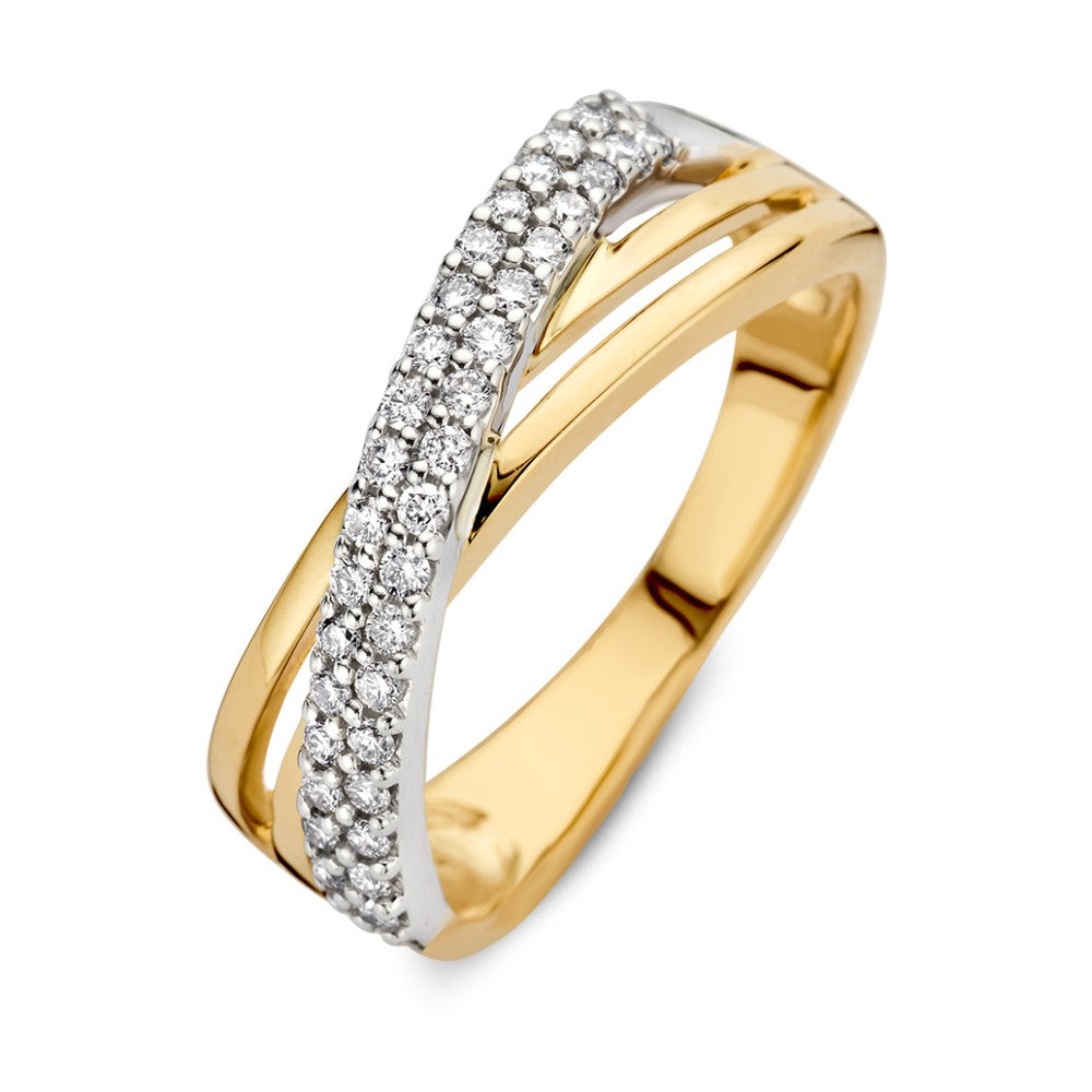 Anillo bicolor de oro blanco y amarillo con diamantes de 0.30 crt, diseño cruzado.