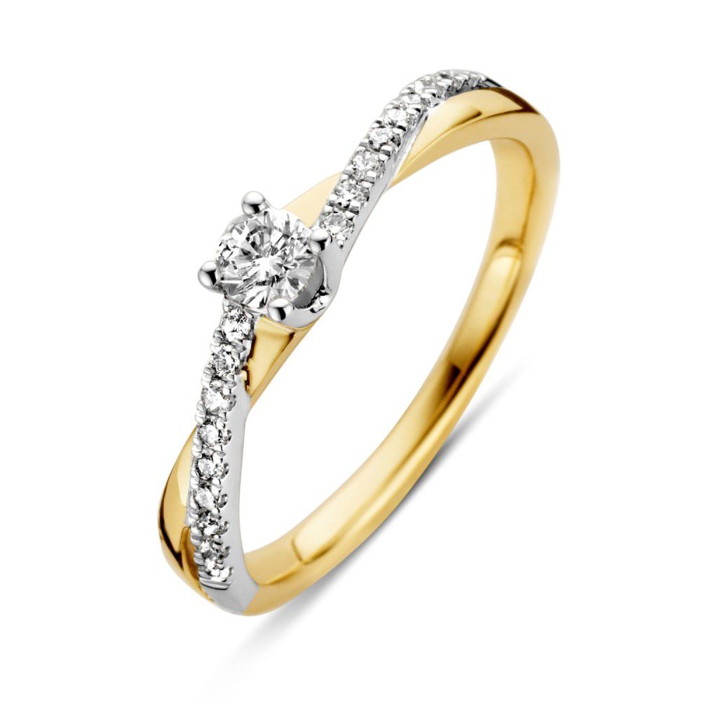 Anillo bicolor de oro amarillo y blanco con diamante brillante de 0.32 crt.