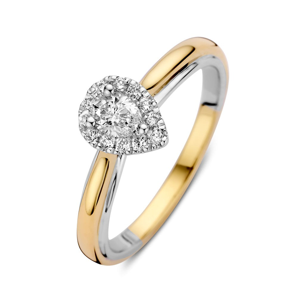 Anillo bicolor de oro de 14k con diamante en forma de pera en engaste de entourage.
