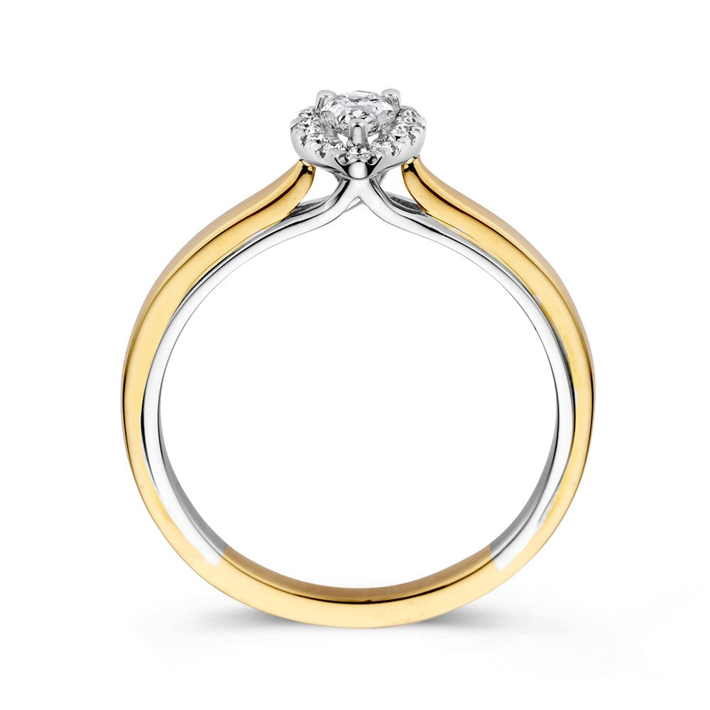Anillo de oro bicolor de 14k con diamante en forma de pera en engaste de entourage