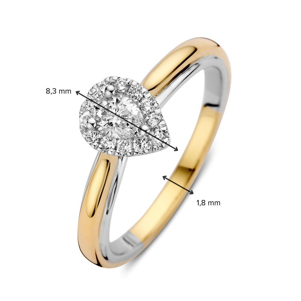 Anillo de oro bicolor de 14k con diamante en forma de pera en engaste de entourage