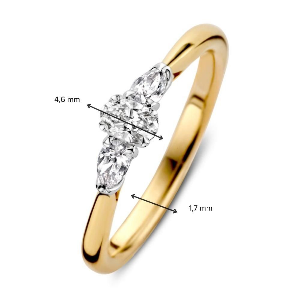 Anillo elegante bicolor de oro con diamante central corte óvalo y dos diamantes laterales en forma de pera (0.35 quilates en total)