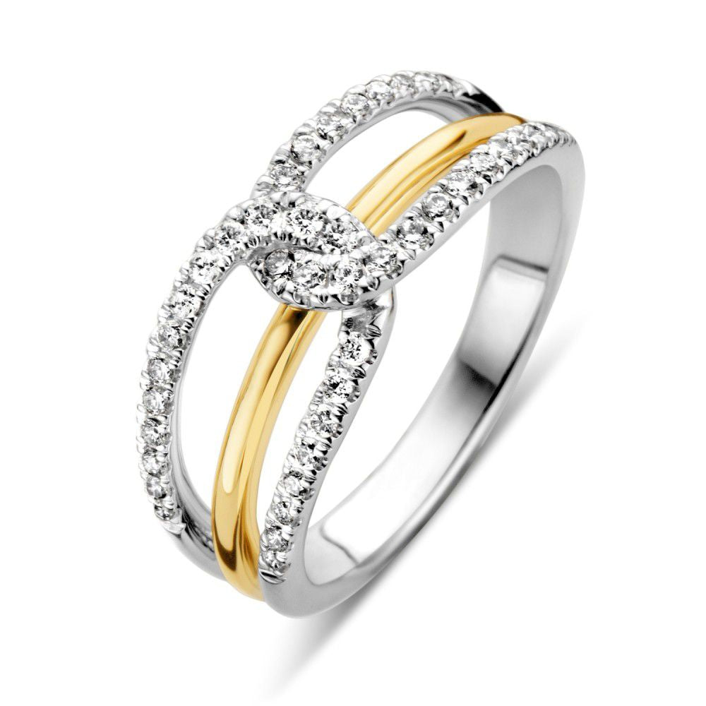 Anillo bicolor de oro blanco y amarillo para dama con brillante de 0.37 crt.