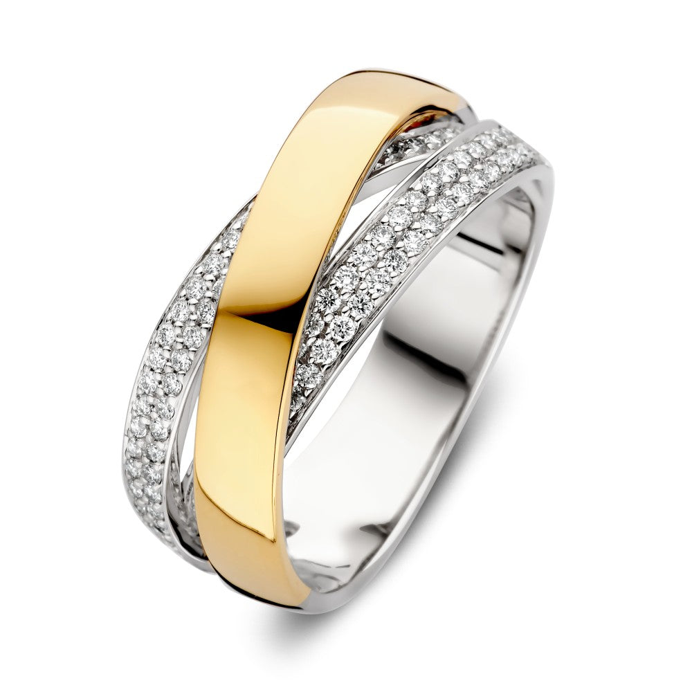 Anillo bicolor de lujo con diamante brillante de 0.37ct, diseño entrelazado en oro y plata.